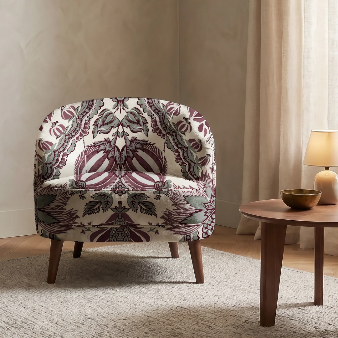 Flowering Pomegranate in linen and blackcurrant: an ogee lattice of lace borders framing a blossom held between two swelling pomegranates, translated from an 18th-century French block-printed quilt. cohort1 vb chair