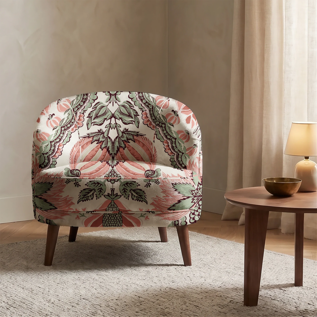 Flowering Pomegranate in linen and terracotta: an ogee lattice of lace borders framing a blossom held between two swelling pomegranates, translated from an 18th-century French block-printed quilt. cohort1 vb chair
