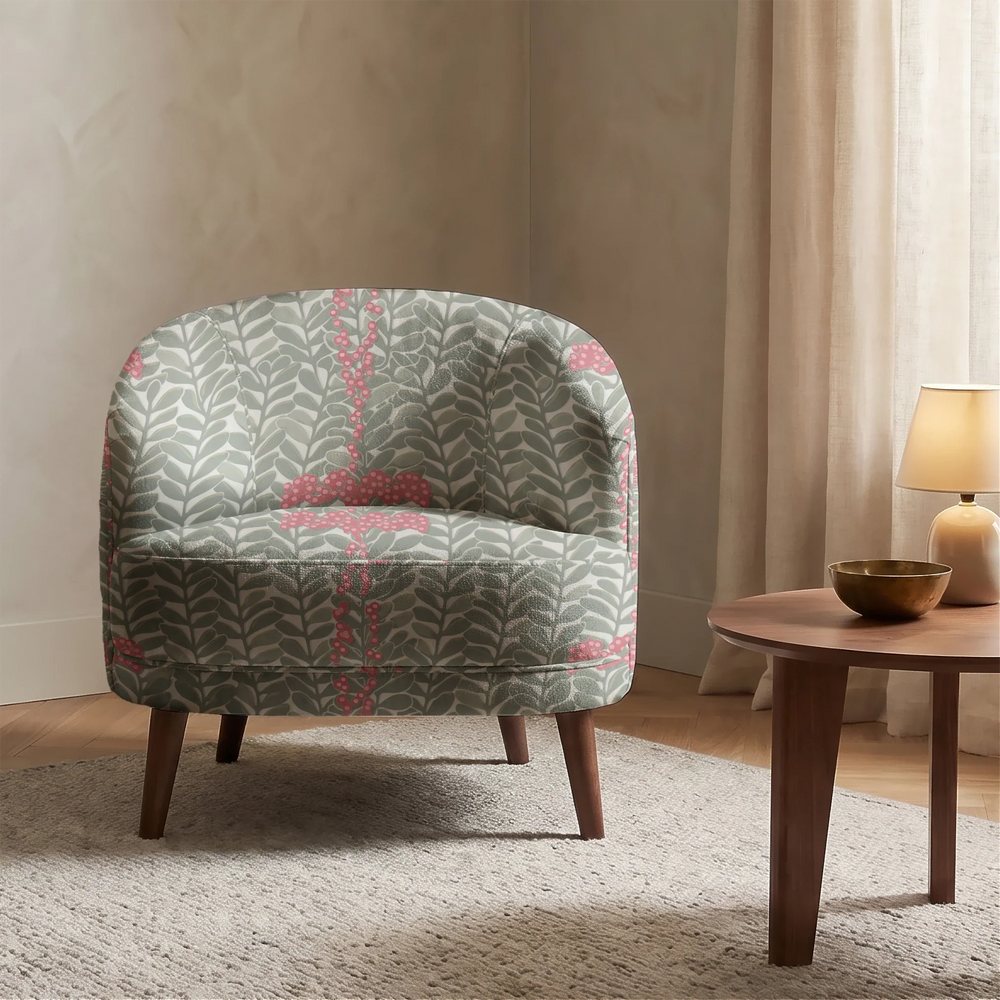 Grey-green 1918 leaf sprays with red berries on a grey ground: chenille armchair upholstery mockup.