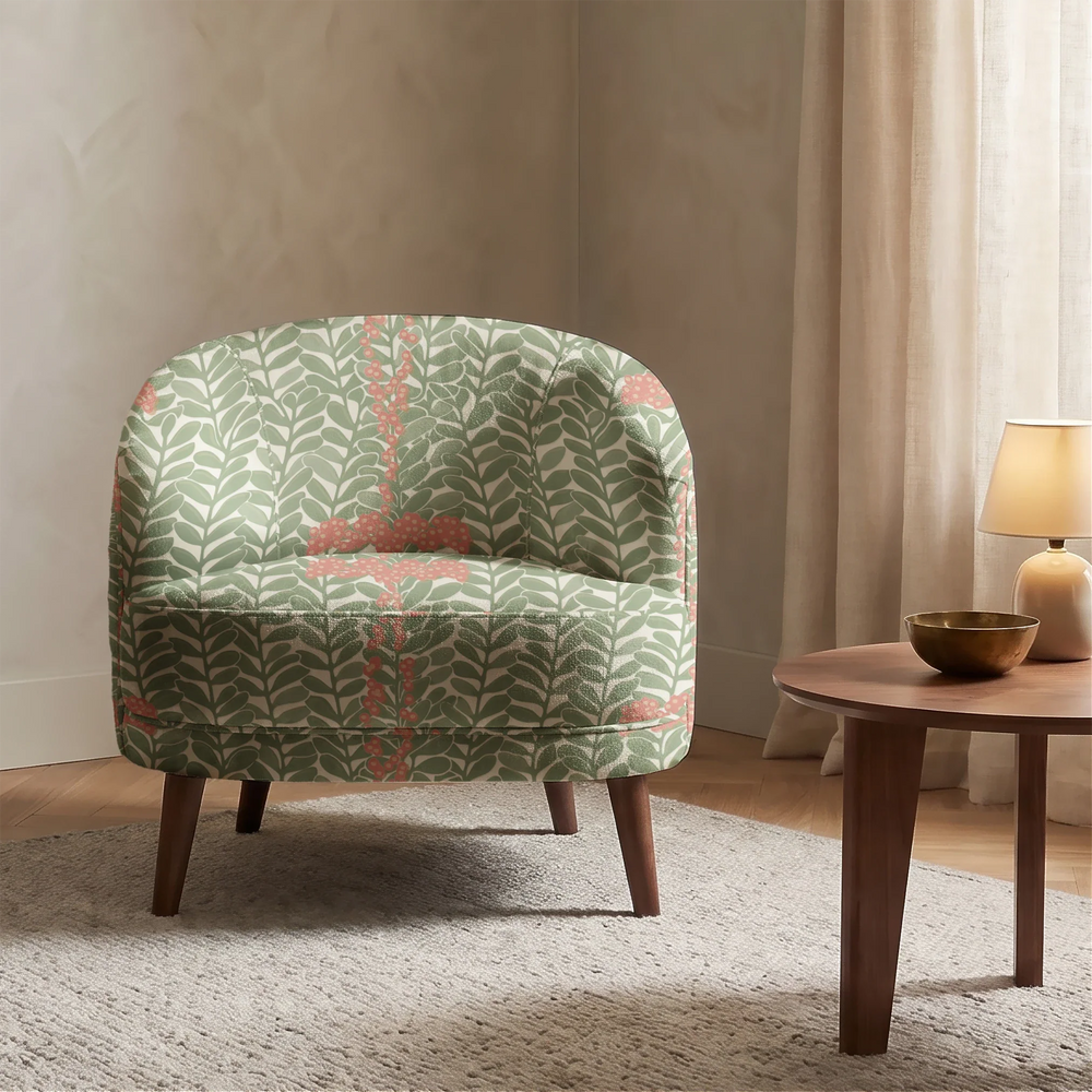 Muted green 1918 leaf sprays with red berries on a beige ground: chenille armchair upholstery mockup.