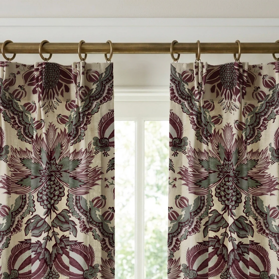 Flowering Pomegranate in linen and blackcurrant: an ogee lattice of lace borders framing a blossom held between two swelling pomegranates, translated from an 18th-century French block-printed quilt. cohort1 vb curtains