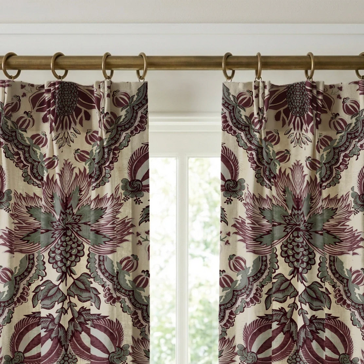 Flowering Pomegranate in linen and blackcurrant: an ogee lattice of lace borders framing a blossom held between two swelling pomegranates, translated from an 18th-century French block-printed quilt. cohort1 vb curtains