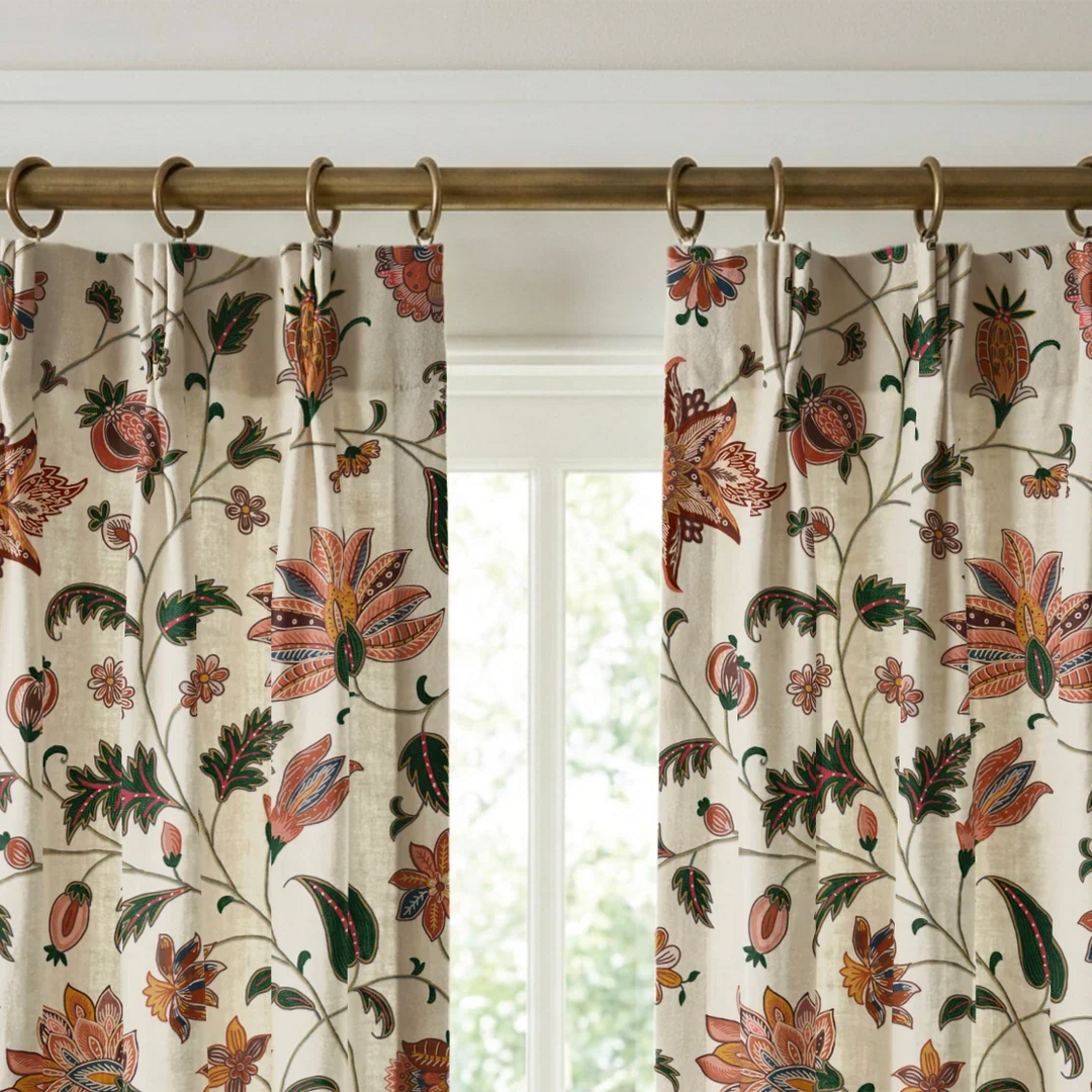 Orange and green floral vines on a white ground linen cotton window curtains mockup.