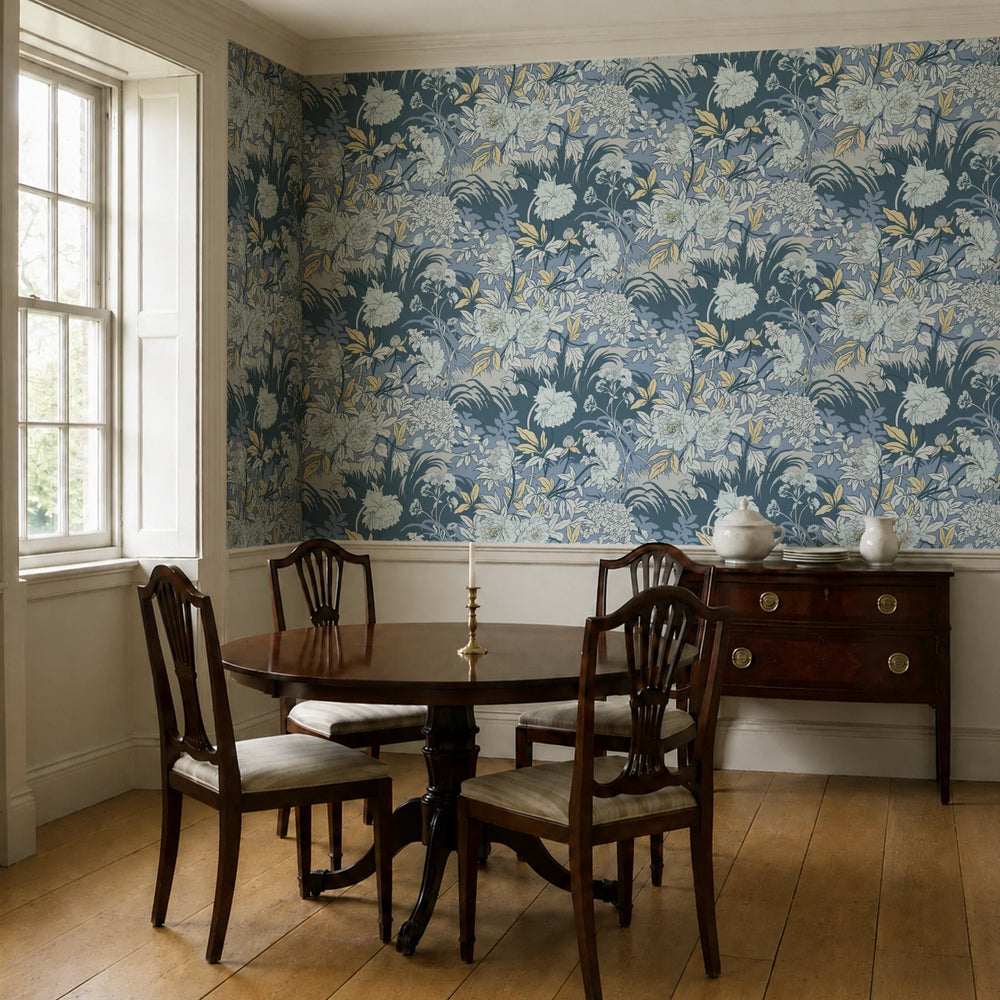 Pale grey 1890s Art Nouveau blooms and grasses on a blue-grey ground: wallpaper installed in a dining room