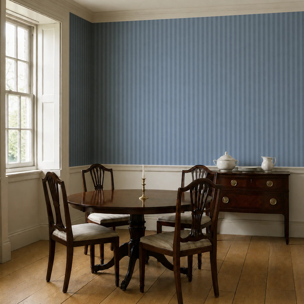 Muted blue 19th century equal-width stripe, deeper bands striated: wallpaper installed in a dining room