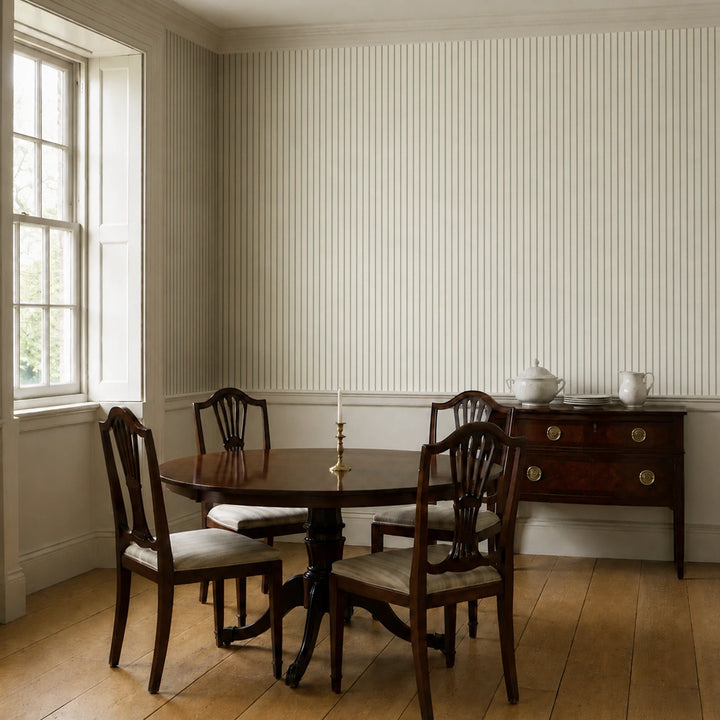 Grey-green woven-texture pencil stripe on a beige ground: wallpaper installed in a dining room
