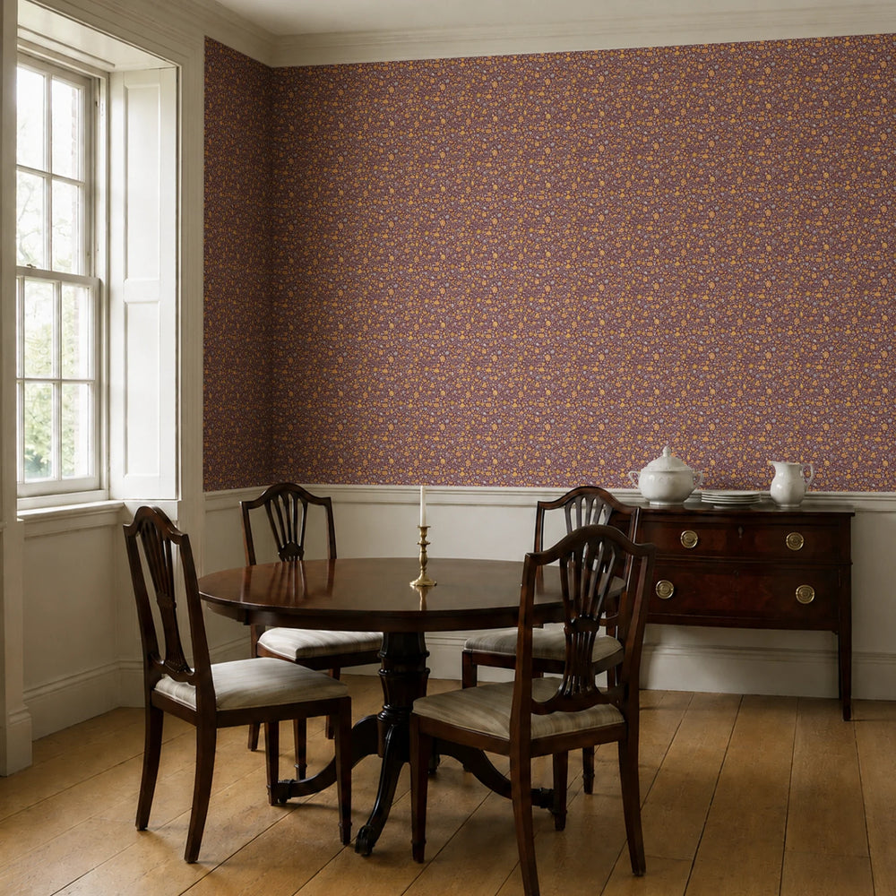 Yellow 18th century Indian chintz vine on a dark purple ground: wallpaper installed in a dining room