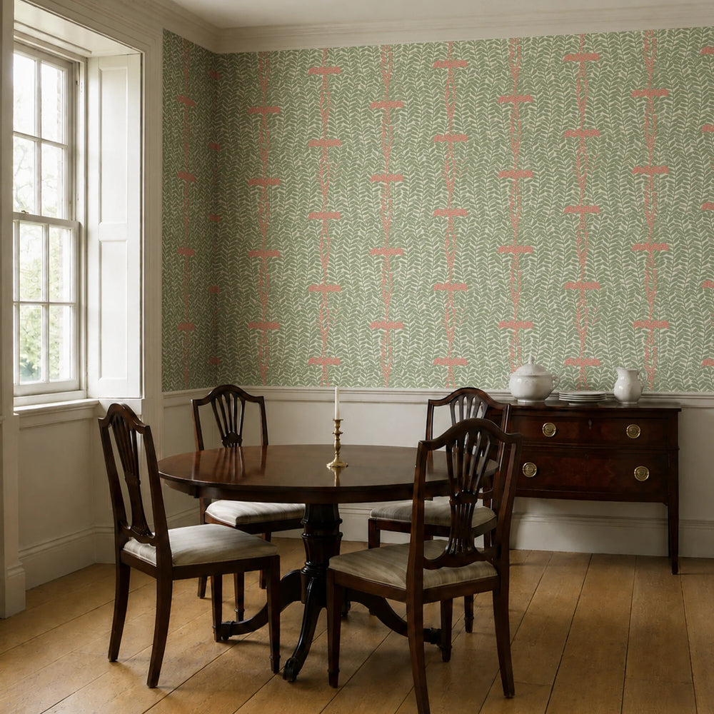 Muted green 1918 leaf sprays with red berries on a beige ground: wallpaper installed in a dining room