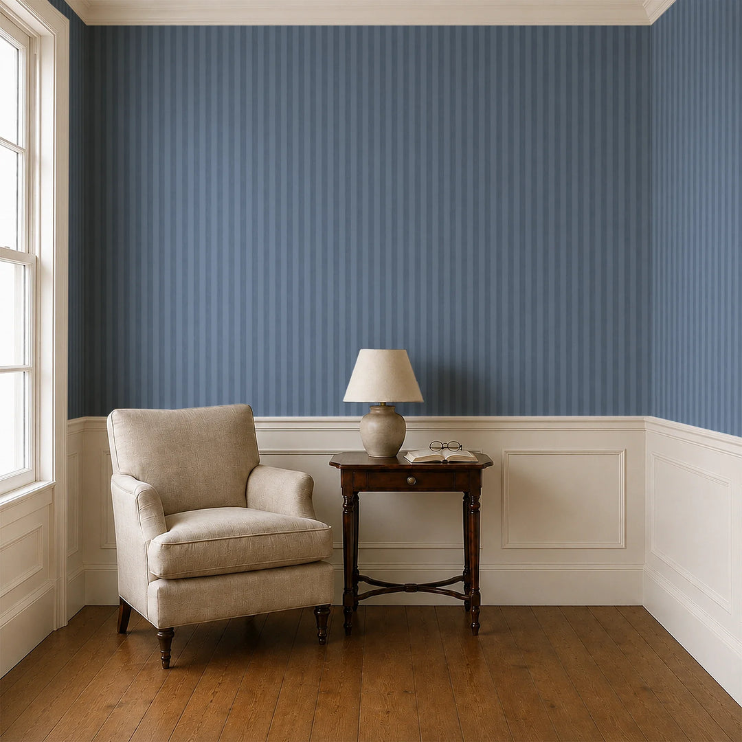 Muted blue 19th century equal-width stripe, deeper bands striated: wallpaper installed in a parlor with panelled dado