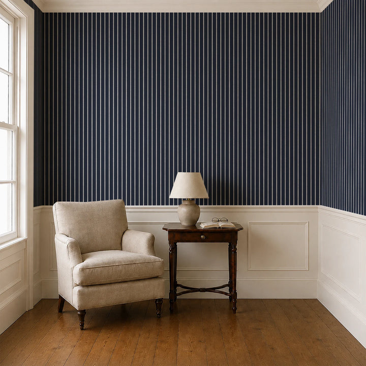 White woven-texture pencil stripe on a navy ground: wallpaper installed in a parlor with panelled dado