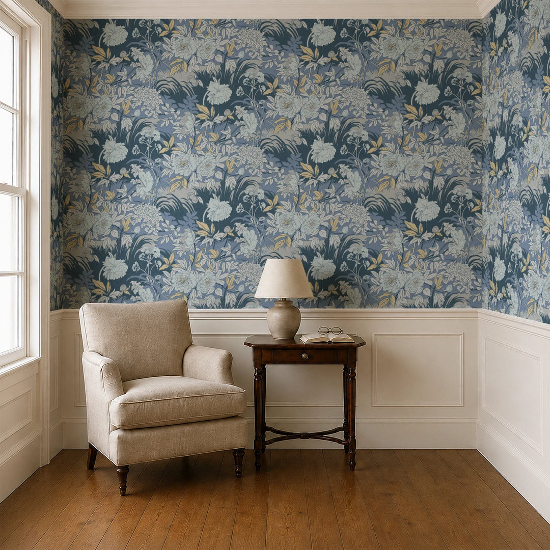 Pale grey 1890s Art Nouveau blooms and grasses on a blue-grey ground: wallpaper installed in a parlor with panelled dado