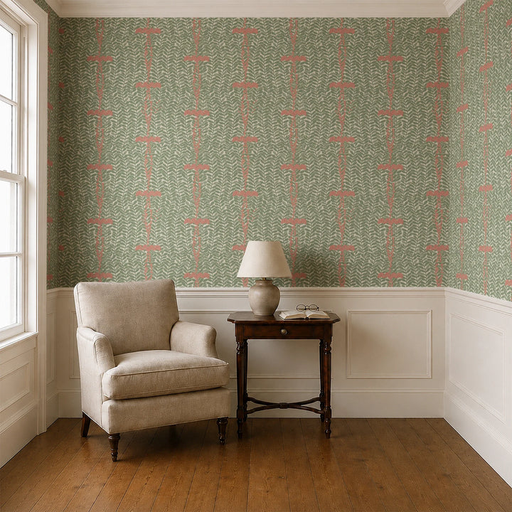 Muted green 1918 leaf sprays with red berries on a beige ground: wallpaper installed in a parlor with panelled dado