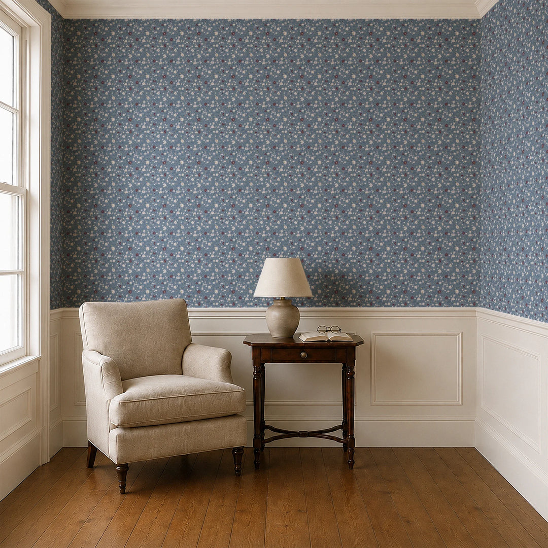 Pink 18th century Indian chintz vine on a muted blue ground: wallpaper installed in a parlor with panelled dado