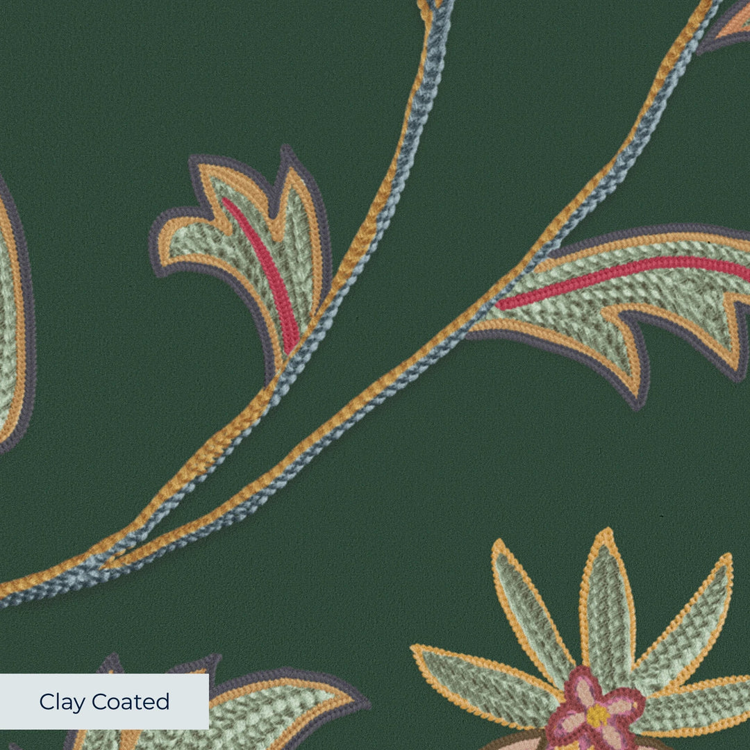 Red and gold florals on a dark green ground clay-coated wallpaper closeup, smooth matte finish