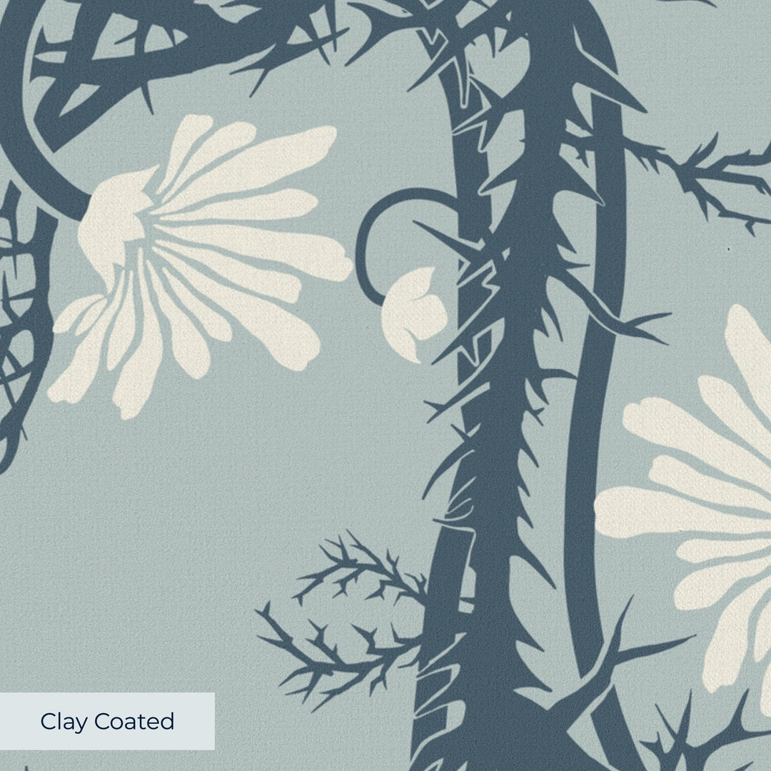 Marguerite in mist and slate: spined, entwined stems forming vertical channels around massed daisy heads, translated from a c. 1904 Dutch linen damask finger towel by Cornelis van der Sluys. clay-coated wallpaper closeup, smooth matte finish