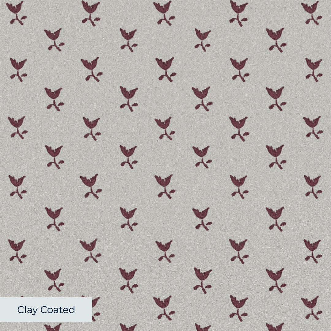Deep red-brown Second Empire tulip silhouette on a pale grey ground: clay-coated wallpaper closeup, smooth matte finish
