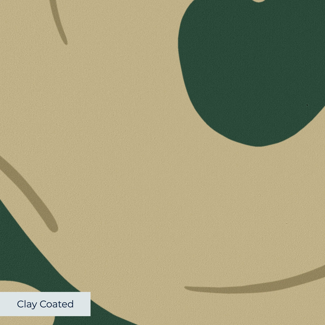 Large gold acanthus scroll motif on a green ground: clay-coated wallpaper closeup, smooth matte finish