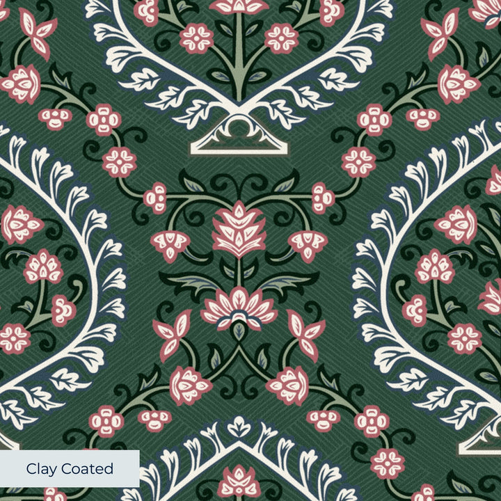 Varanasi Medallion in Forest Floor and Ivory — rose-pink flowers inside pale pointed medallions on a deep green ground clay-coated wallpaper closeup, smooth matte finish