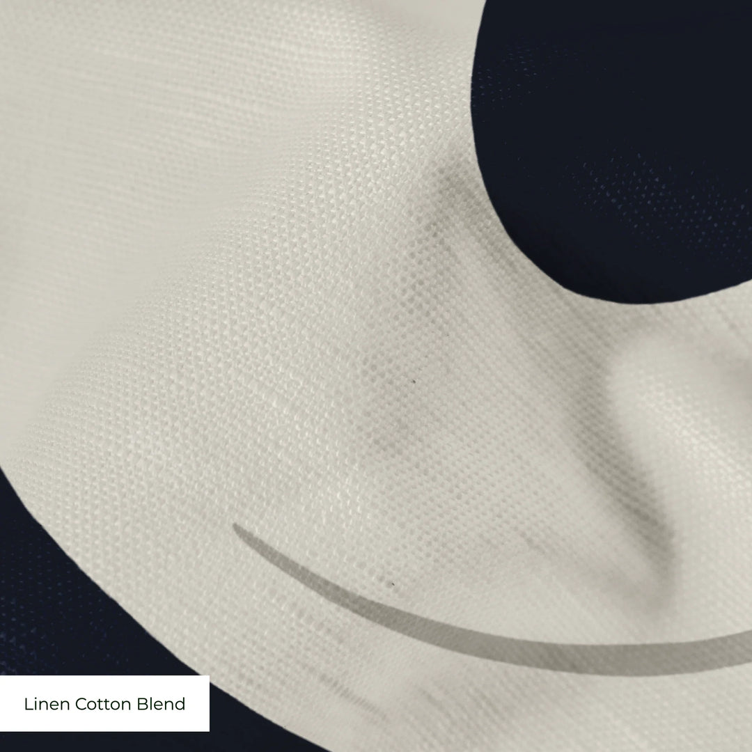 Large beige acanthus scroll motif on a navy ground: linen cotton blend swatch close-up.