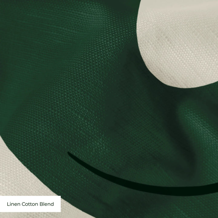 Large green acanthus scroll motif on a beige ground: linen cotton blend swatch close-up.