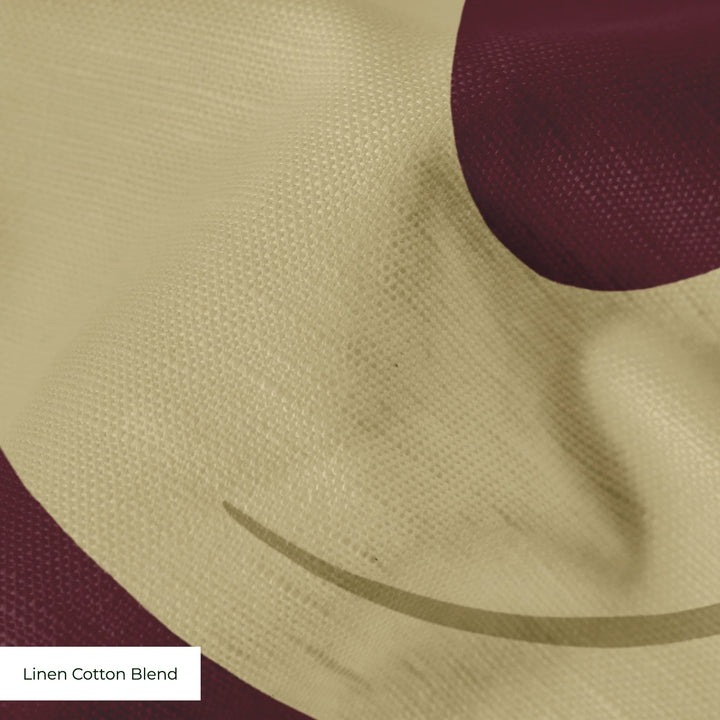 Large gold acanthus scroll motif on a red ground: linen cotton blend swatch close-up.