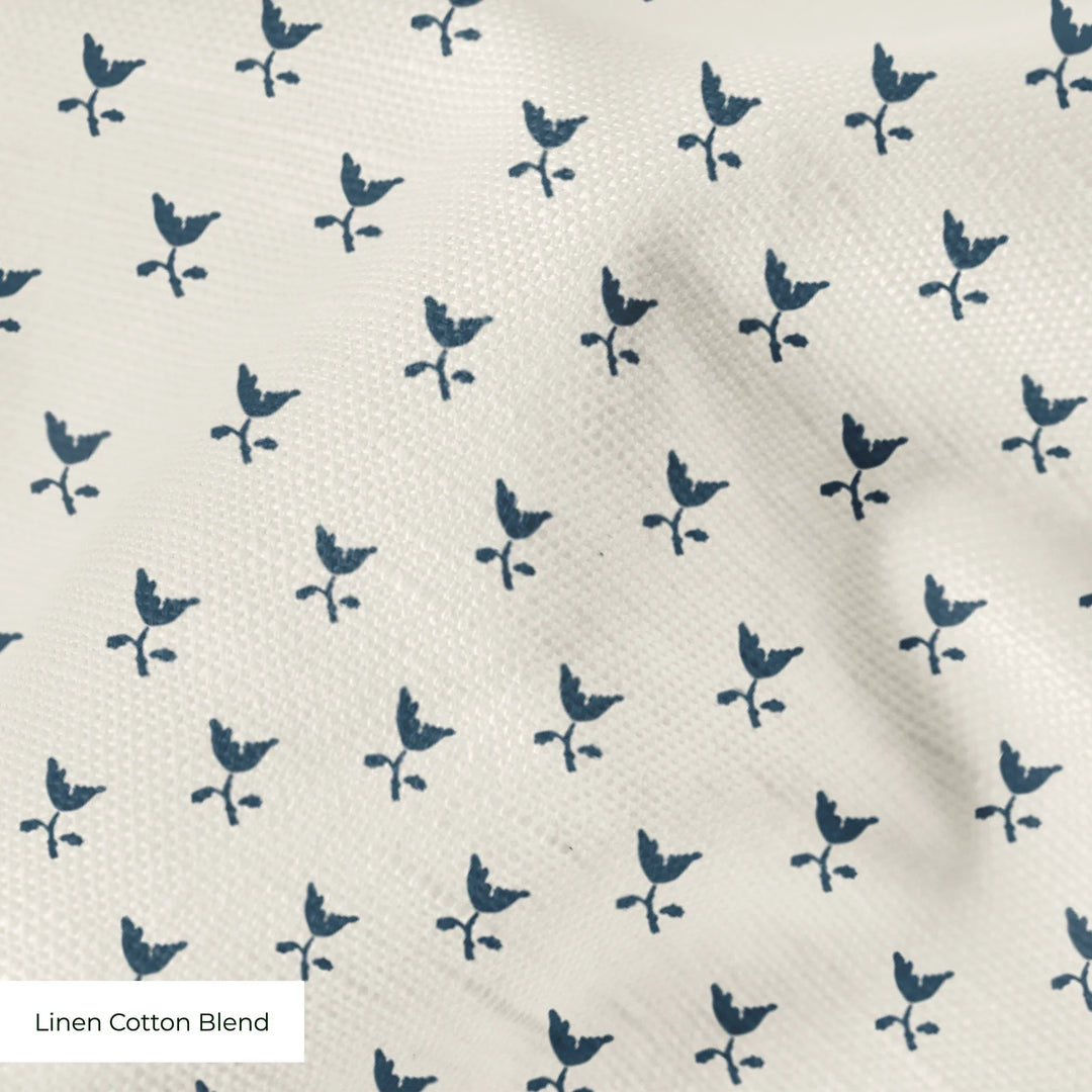 Blue-grey Second Empire tulip silhouette on a warm ivory ground: linen cotton blend swatch close-up.