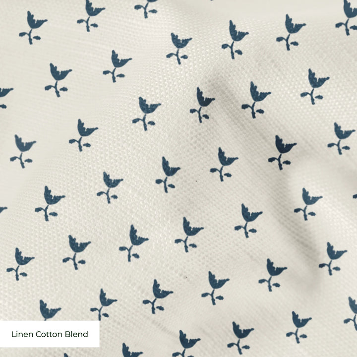 Blue-grey Second Empire tulip silhouette on a warm ivory ground: linen cotton blend swatch close-up.