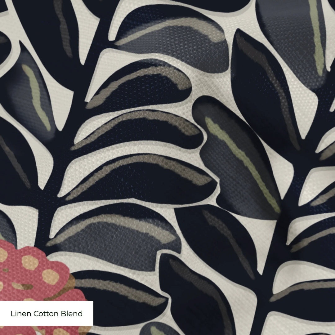 Navy 1918 leaf sprays with red berries on a beige ground: linen cotton blend swatch close-up.