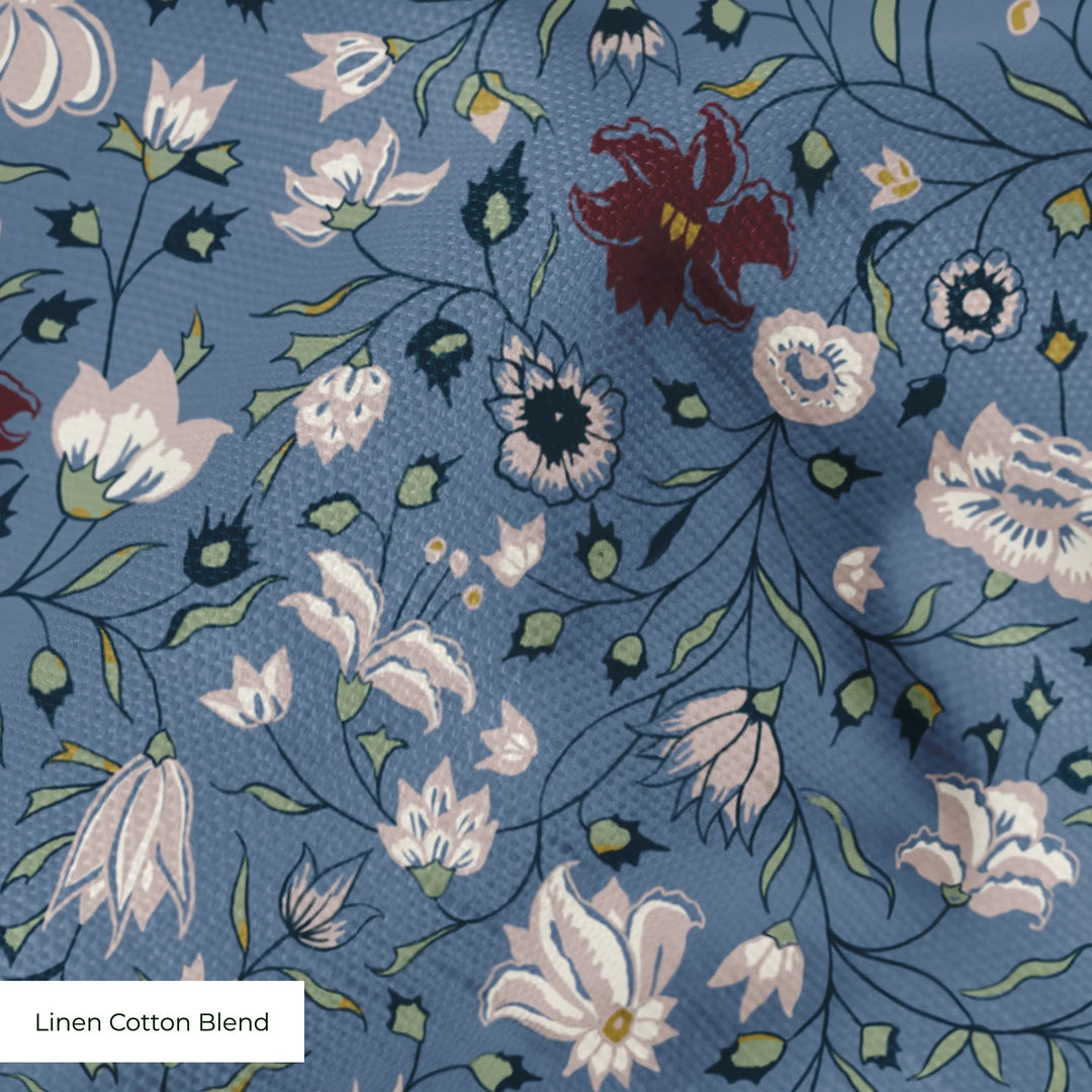 Pink 18th century Indian chintz vine on a muted blue ground: linen cotton blend swatch close-up.