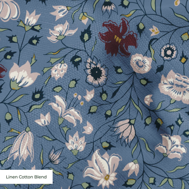 Pink 18th century Indian chintz vine on a muted blue ground: linen cotton blend swatch close-up.