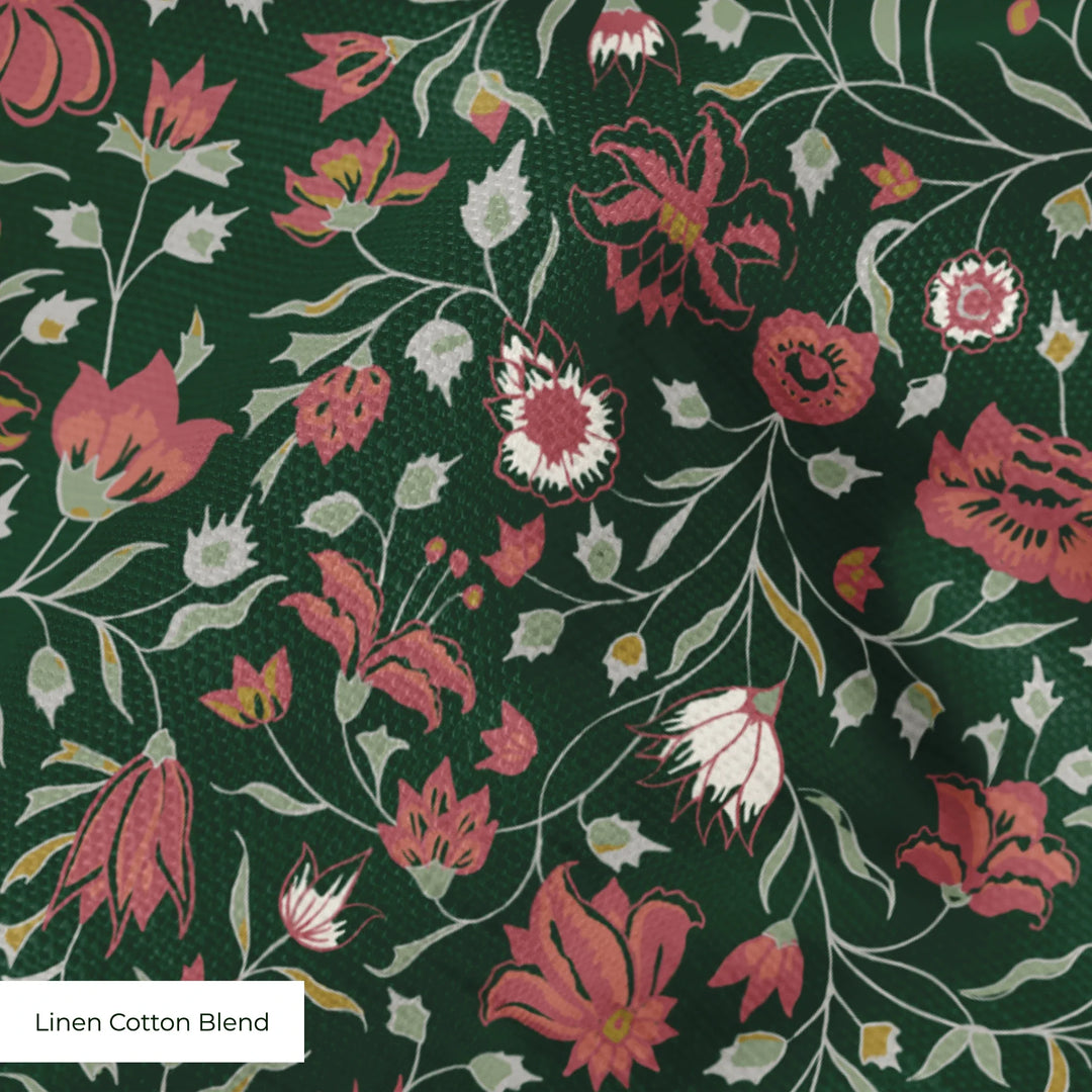 Red 18th century Indian chintz vine on a dark green ground: linen cotton blend swatch close-up.