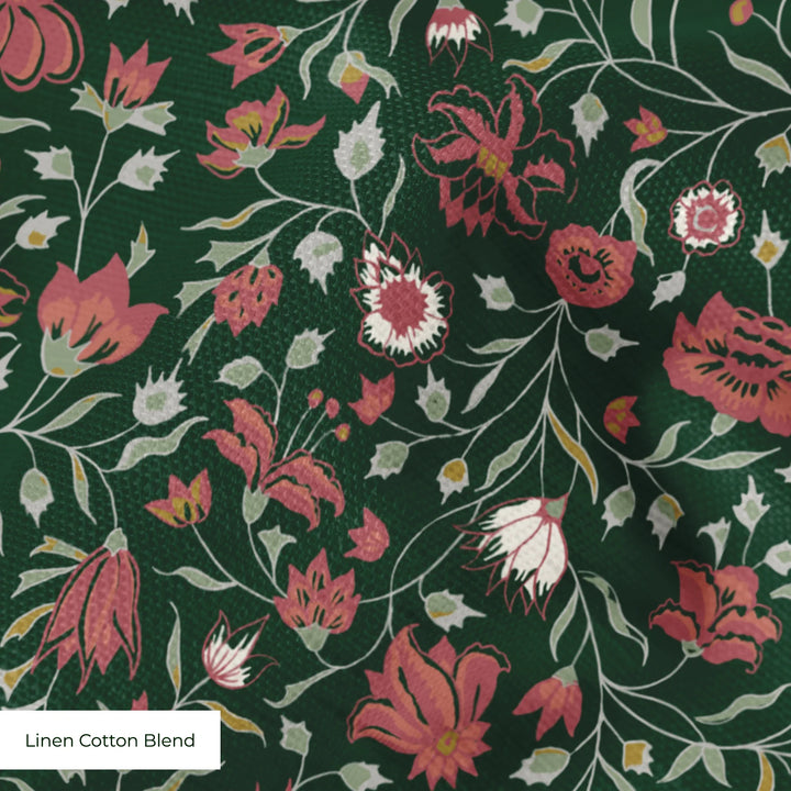 Red 18th century Indian chintz vine on a dark green ground: linen cotton blend swatch close-up.