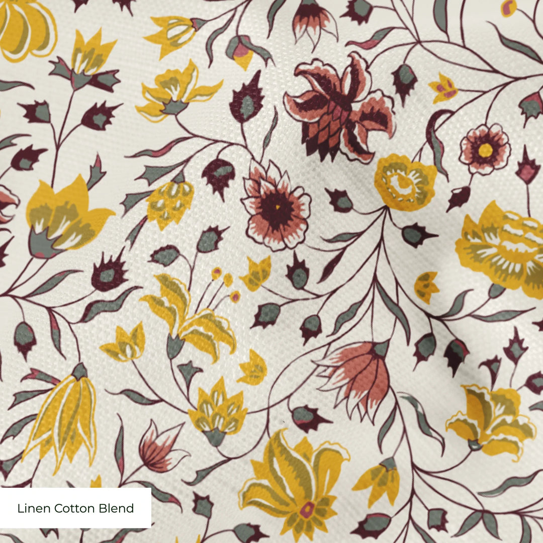 Yellow 18th century Indian chintz vine on a white ground: linen cotton blend swatch close-up.