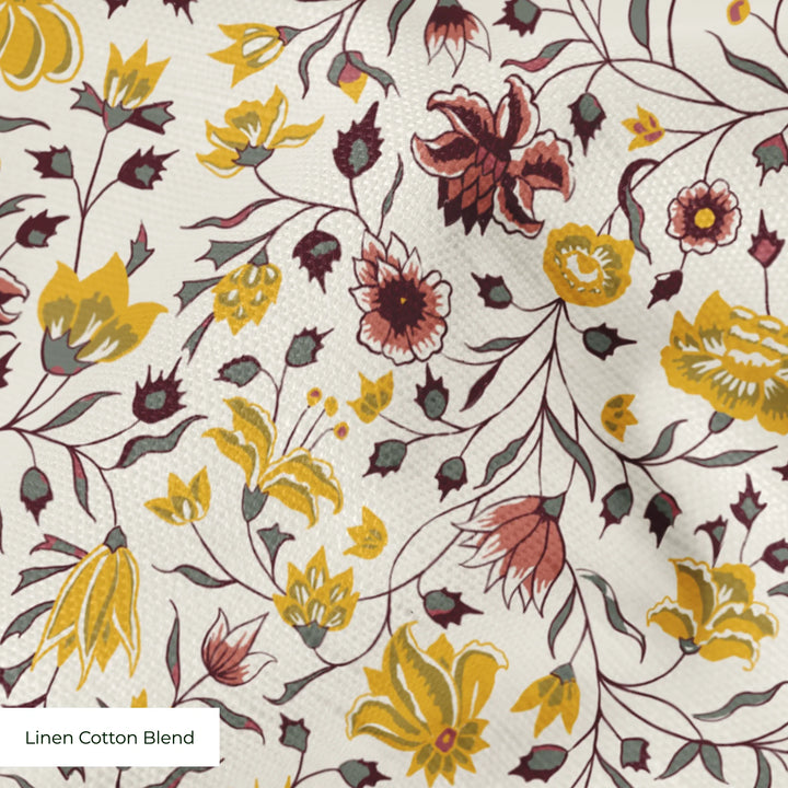 Yellow 18th century Indian chintz vine on a white ground: linen cotton blend swatch close-up.