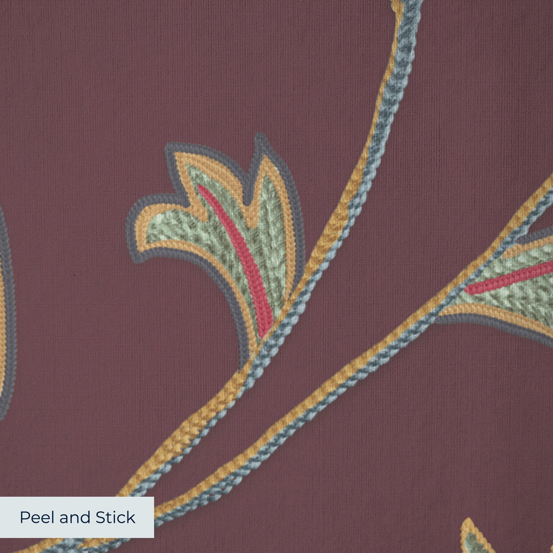 Red and gold florals on a dark purple ground peel-and-stick wallpaper closeup, linen-like texture