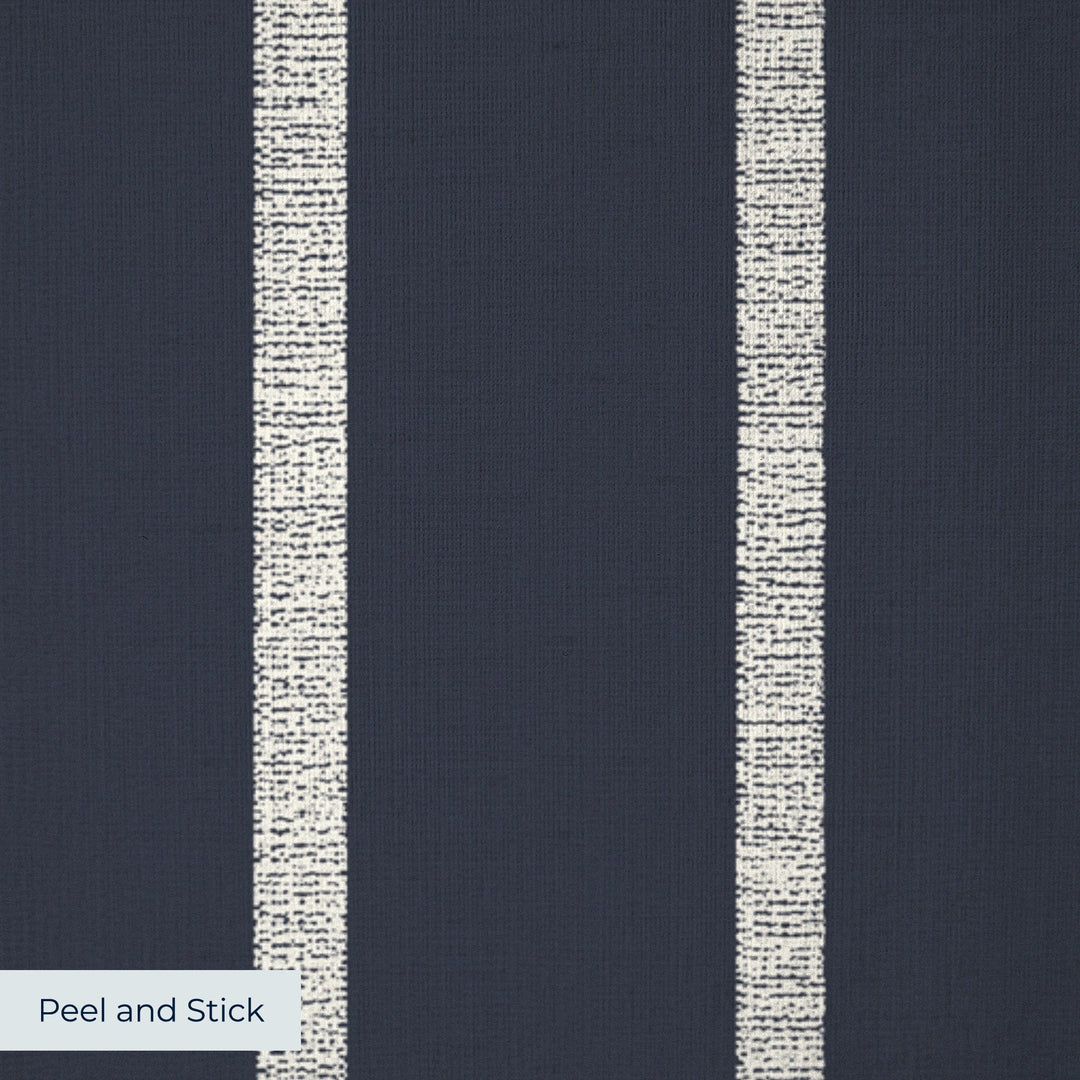White woven-texture pencil stripe on a navy ground: peel-and-stick wallpaper closeup, linen-like texture