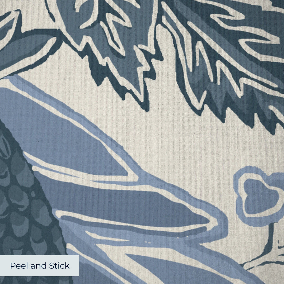 Flowering Pomegranate in linen and dusty blue: an ogee lattice of lace borders framing a blossom held between two swelling pomegranates, translated from an 18th-century French block-printed quilt. peel-and-stick wallpaper closeup, linen-like texture