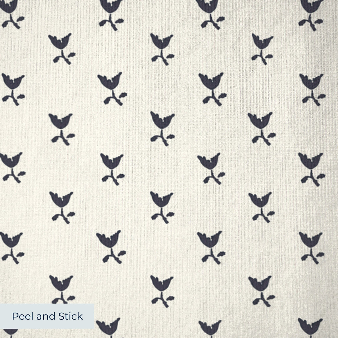 Near-black blue Second Empire tulip silhouette on an ivory ground: peel-and-stick wallpaper closeup, linen-like texture