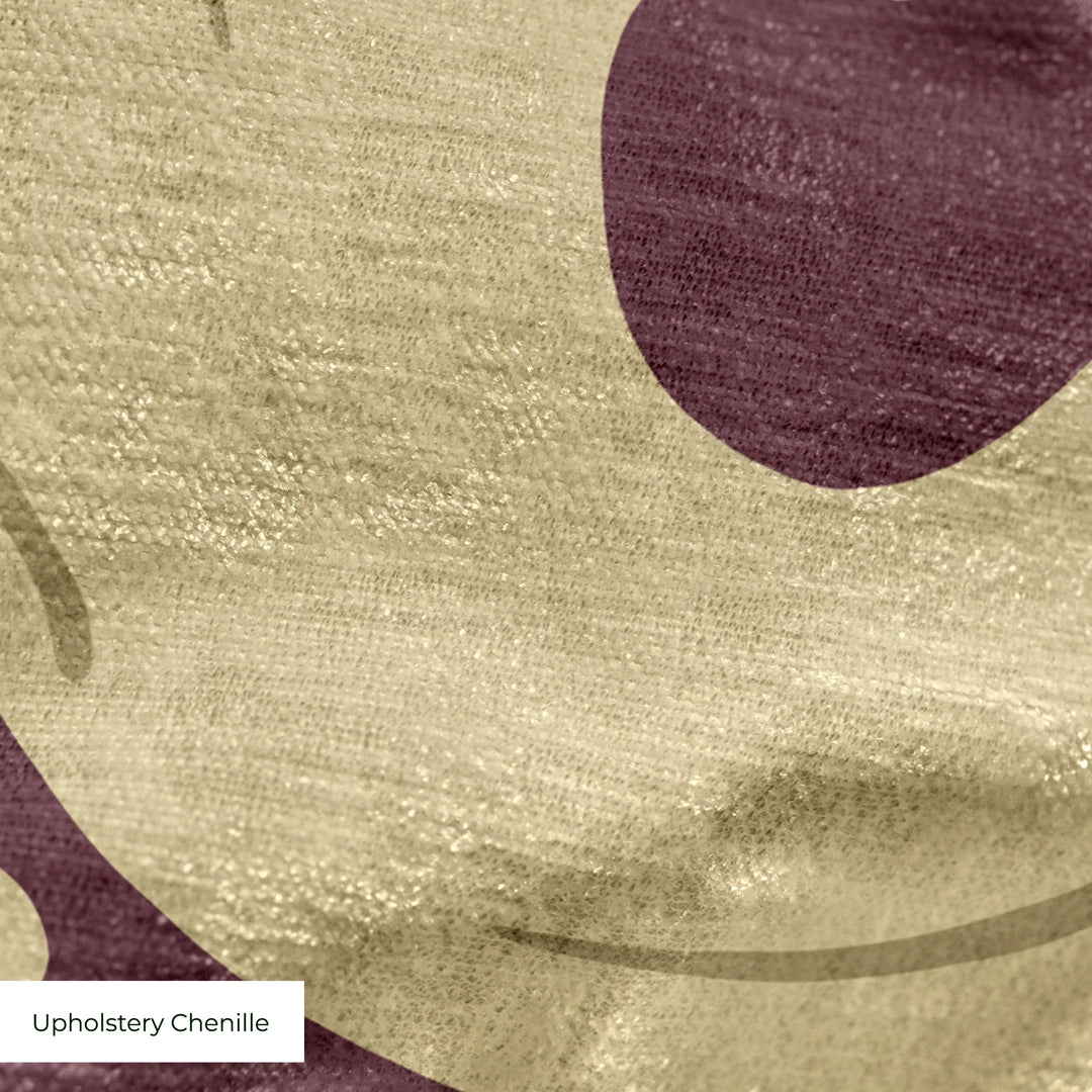 Large gold acanthus scroll motif on a red ground: upholstery chenille swatch close-up.