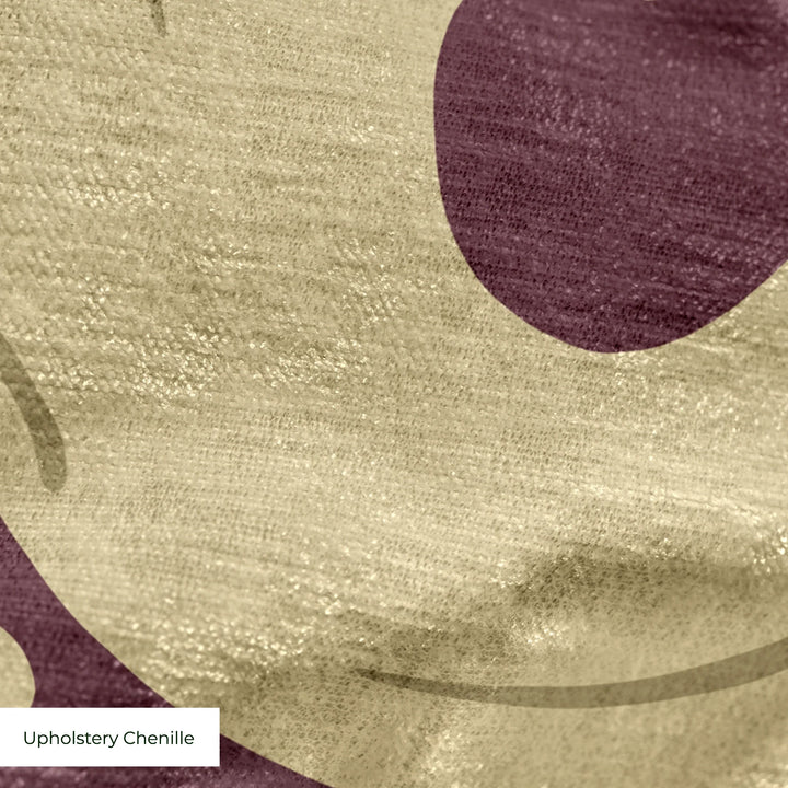 Large gold acanthus scroll motif on a red ground: upholstery chenille swatch close-up.