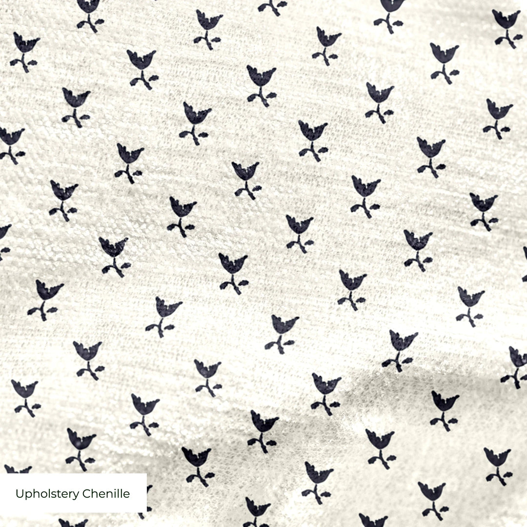 Near-black blue Second Empire tulip silhouette on an ivory ground: upholstery chenille swatch close-up.