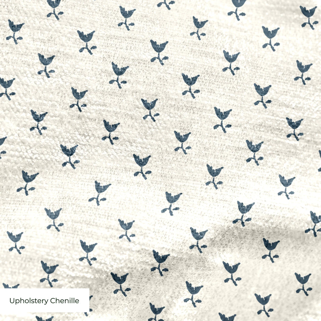 Blue-grey Second Empire tulip silhouette on a warm ivory ground: upholstery chenille swatch close-up.