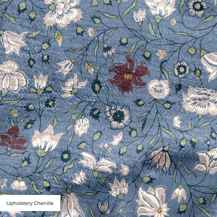 Pink 18th century Indian chintz vine on a muted blue ground: upholstery chenille swatch close-up.