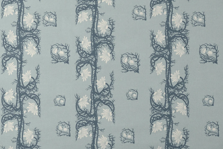 Marguerite in mist and slate: spined, entwined stems forming vertical channels around massed daisy heads, translated from a c. 1904 Dutch linen damask finger towel by Cornelis van der Sluys. designs flat mockup