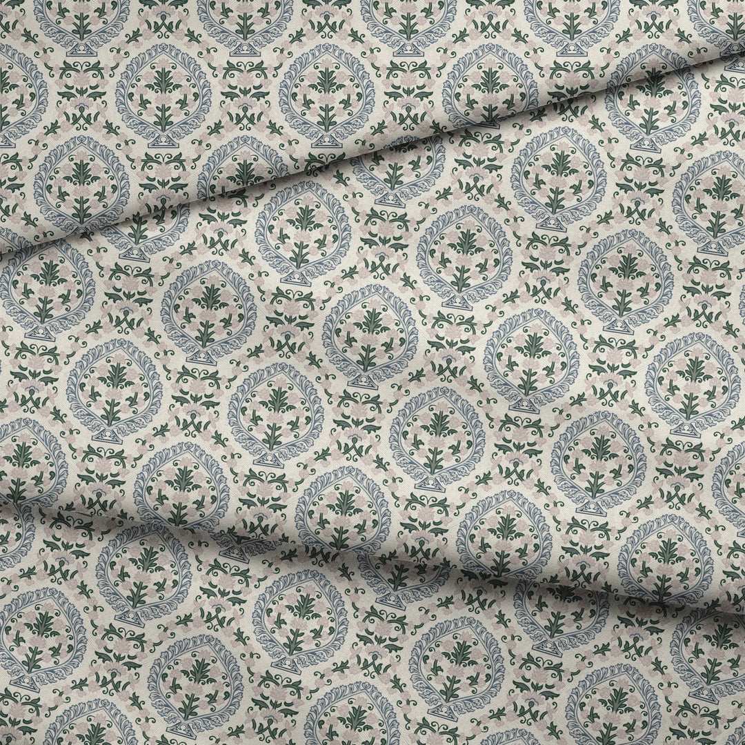 Varanasi Medallion in Ivory and Linen — slate-blue pointed medallions enclosing flowering plants on a near-white ground fabric fold mockup