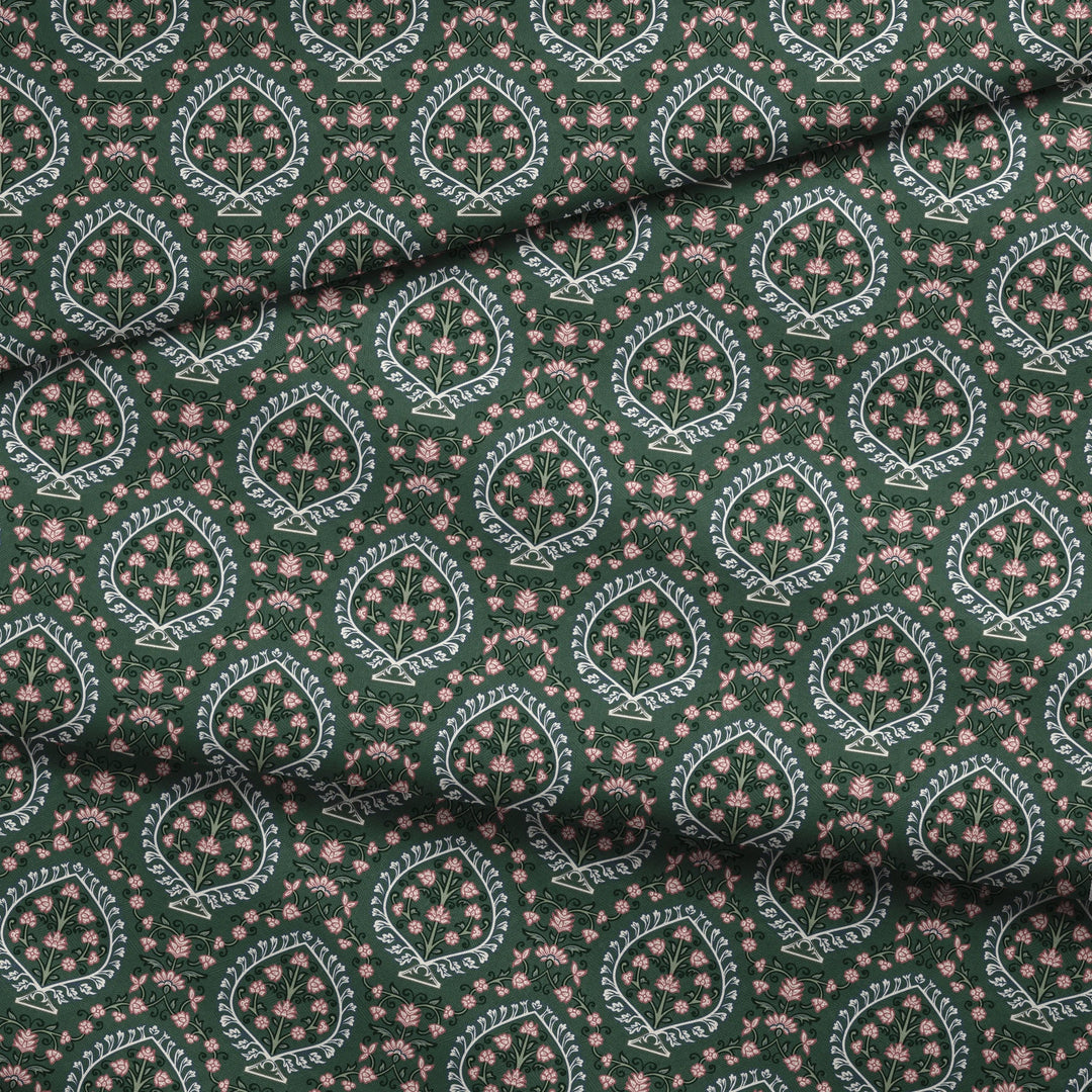 Varanasi Medallion in Forest Floor and Ivory — rose-pink flowers inside pale pointed medallions on a deep green ground fabric fold mockup
