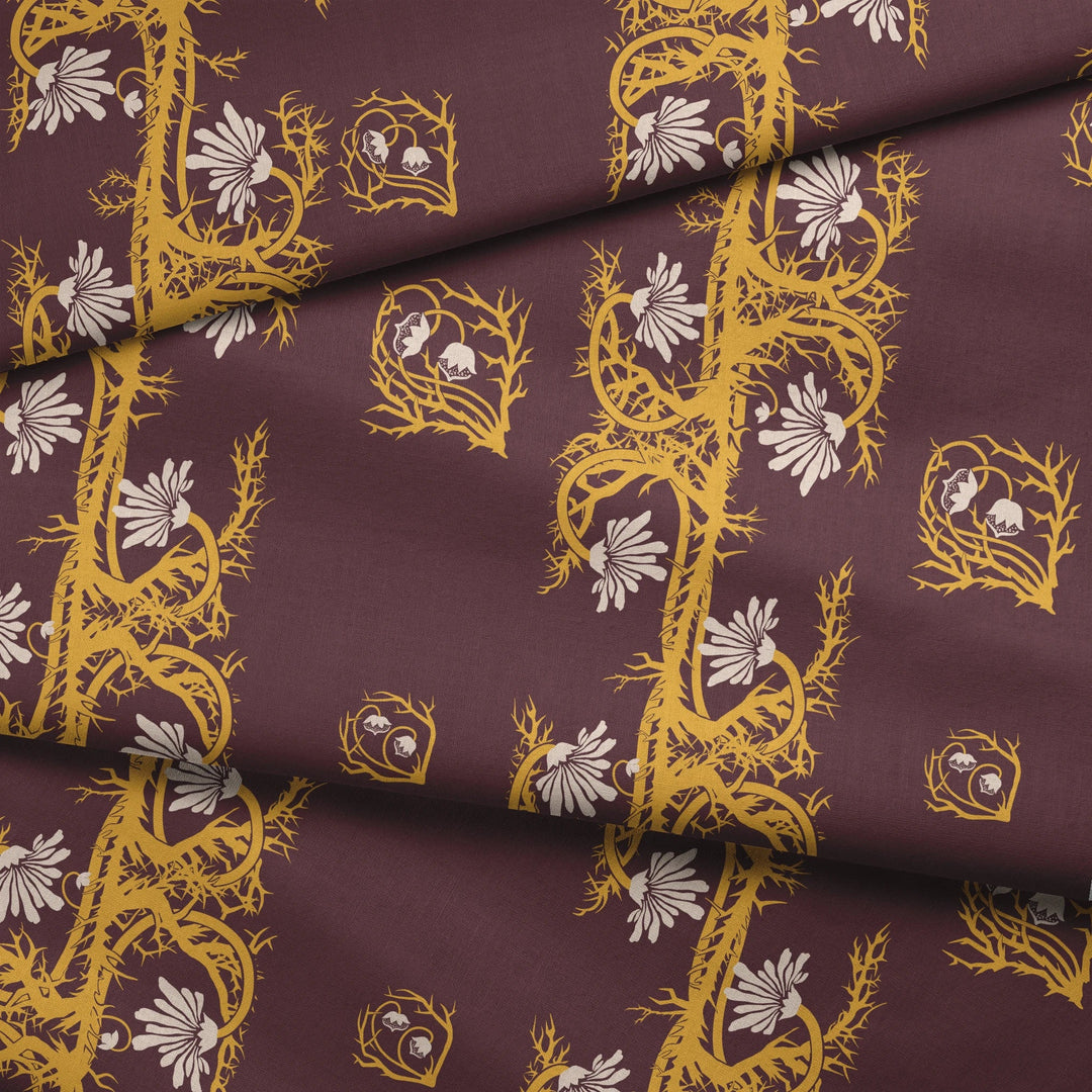Marguerite in blackcurrant and marigold: spined, entwined stems forming vertical channels around massed daisy heads, translated from a c. 1904 Dutch linen damask finger towel by Cornelis van der Sluys. fabric fold mockup