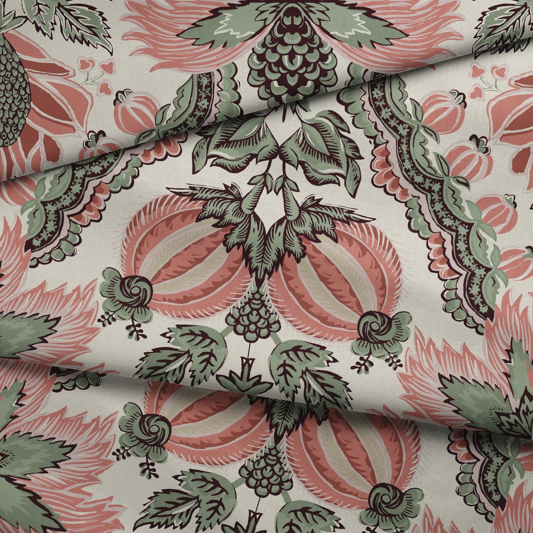 Flowering Pomegranate in linen and terracotta: an ogee lattice of lace borders framing a blossom held between two swelling pomegranates, translated from an 18th-century French block-printed quilt. fabric fold mockup