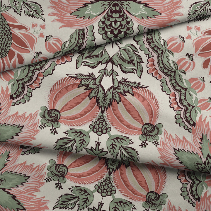 Flowering Pomegranate in linen and terracotta: an ogee lattice of lace borders framing a blossom held between two swelling pomegranates, translated from an 18th-century French block-printed quilt. fabric fold mockup