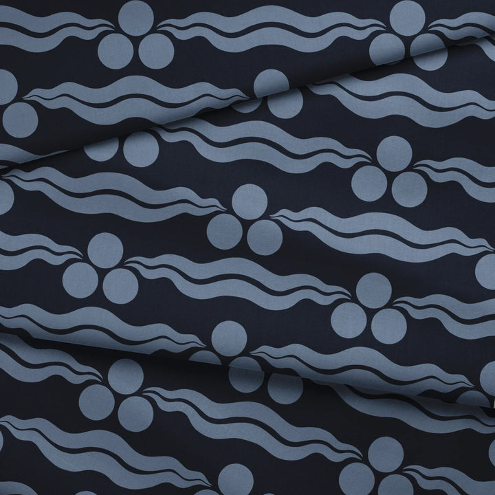 Chintamani Tiger in indigo and dusty blue: triple-disc chintamani roundels above paired wave bands, translated from a 15th-century Bursa silk velvet at The Metropolitan Museum of Art. fabric fold mockup